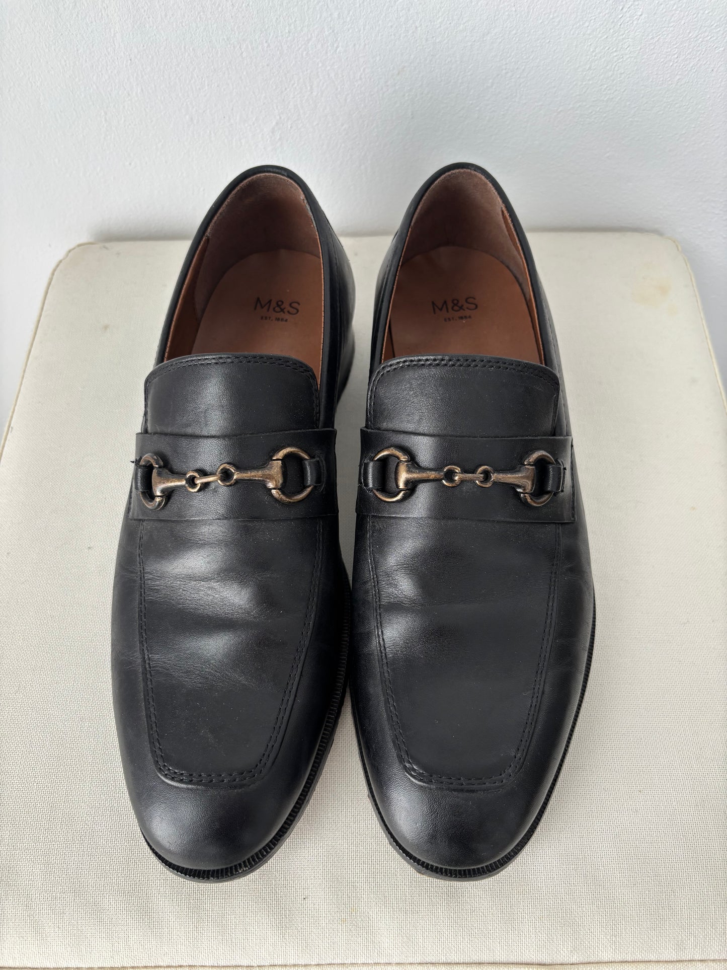 Black loafers with buckle