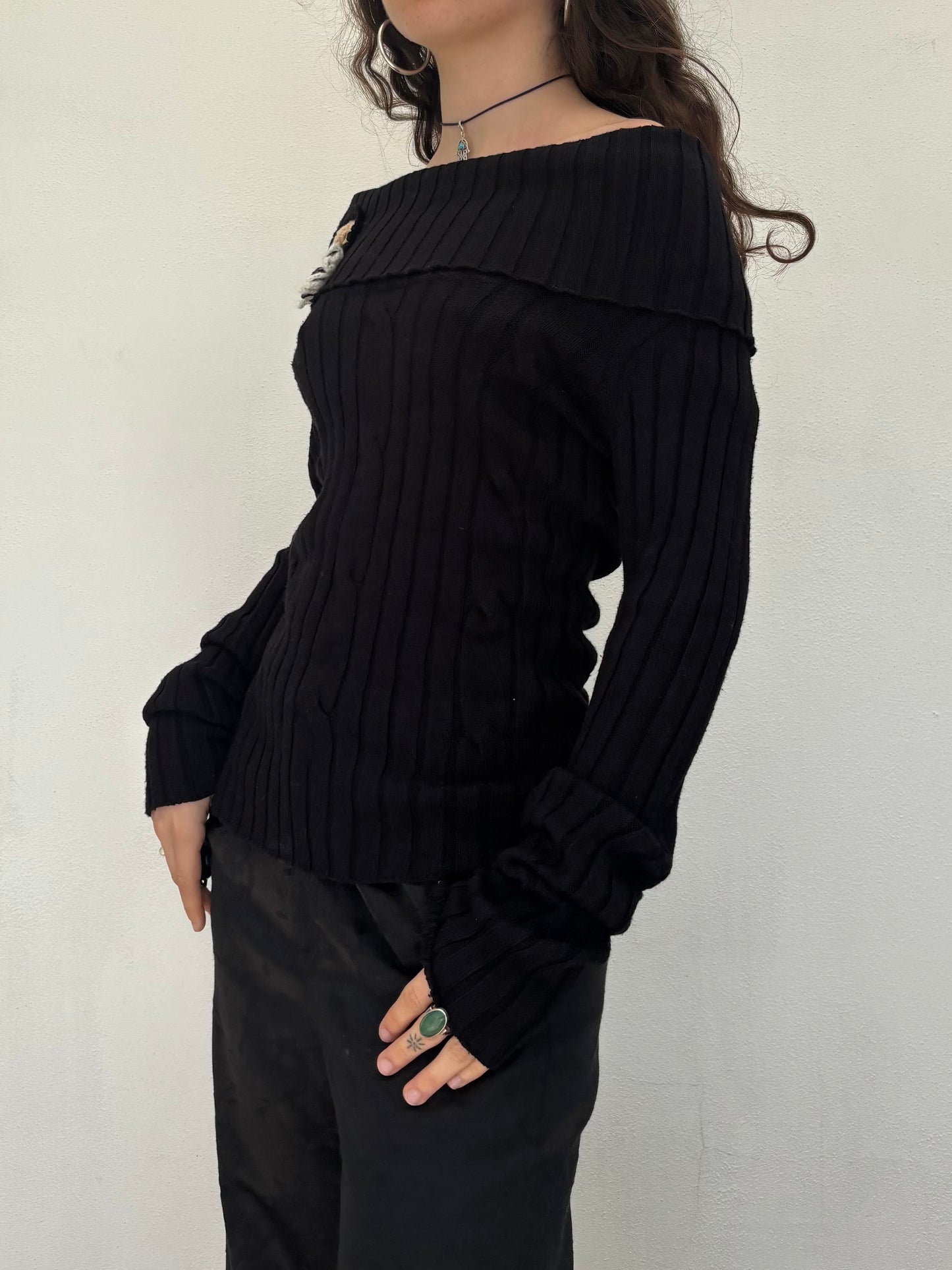 Black off the shoulder knit top with flower details