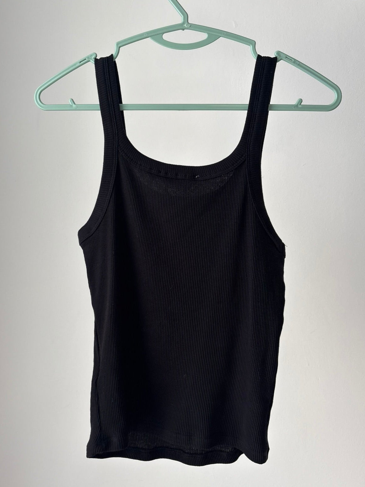 Reworked black tank top with fabric paint