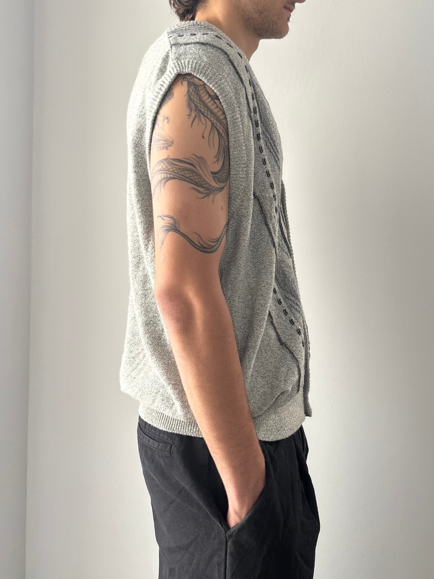 Grey sweater vest with patterns