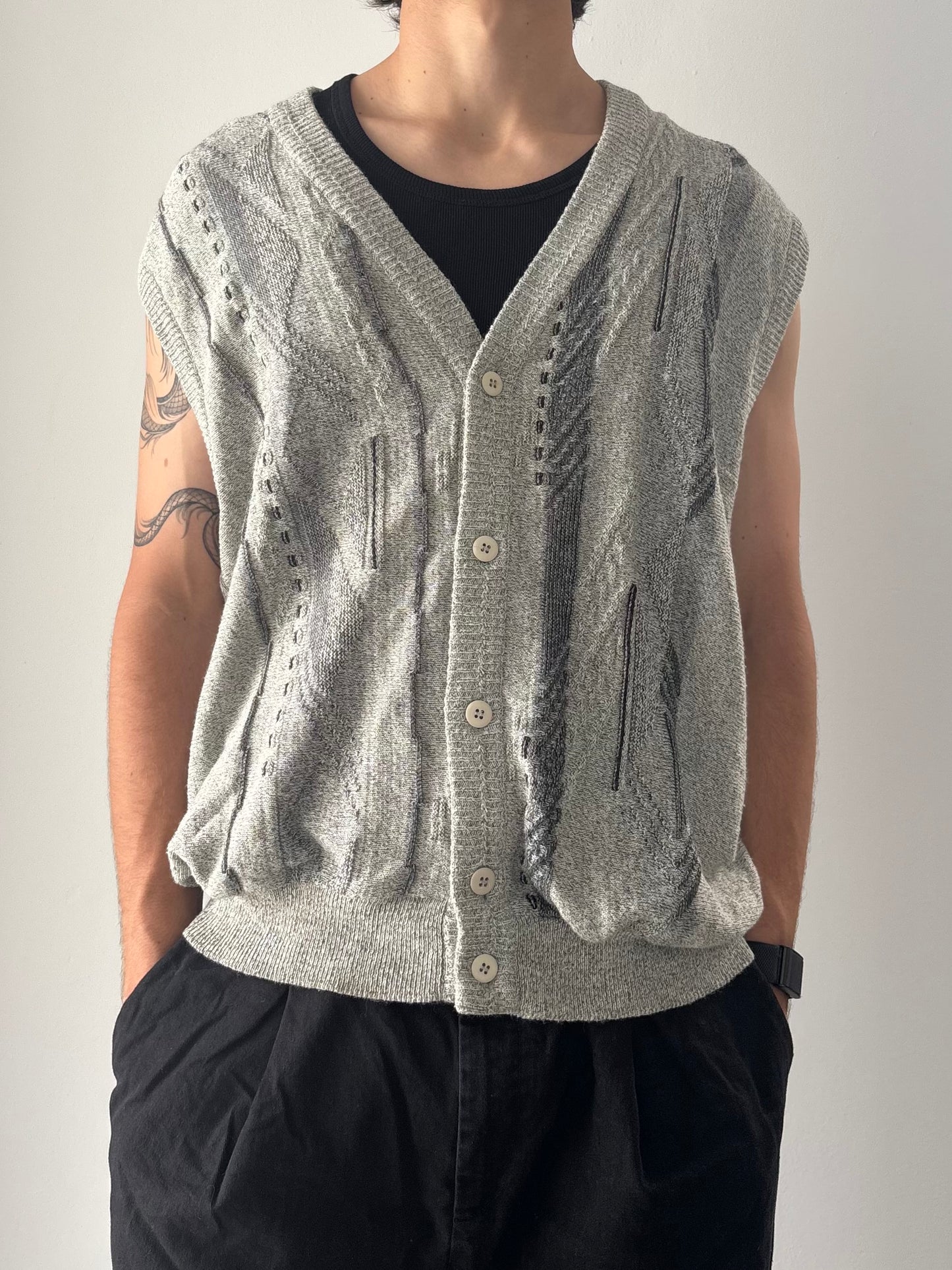 Grey sweater vest with patterns