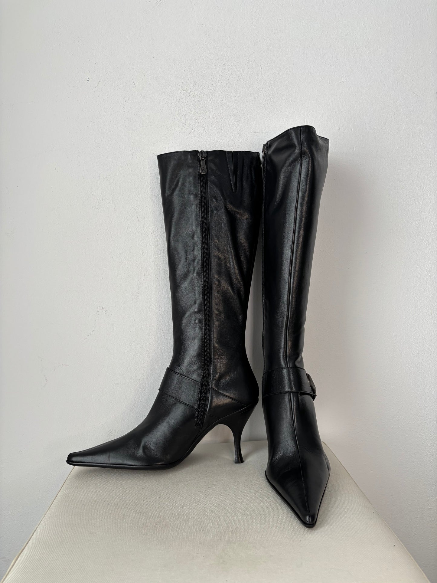 Black leather heeled boots with moon stud