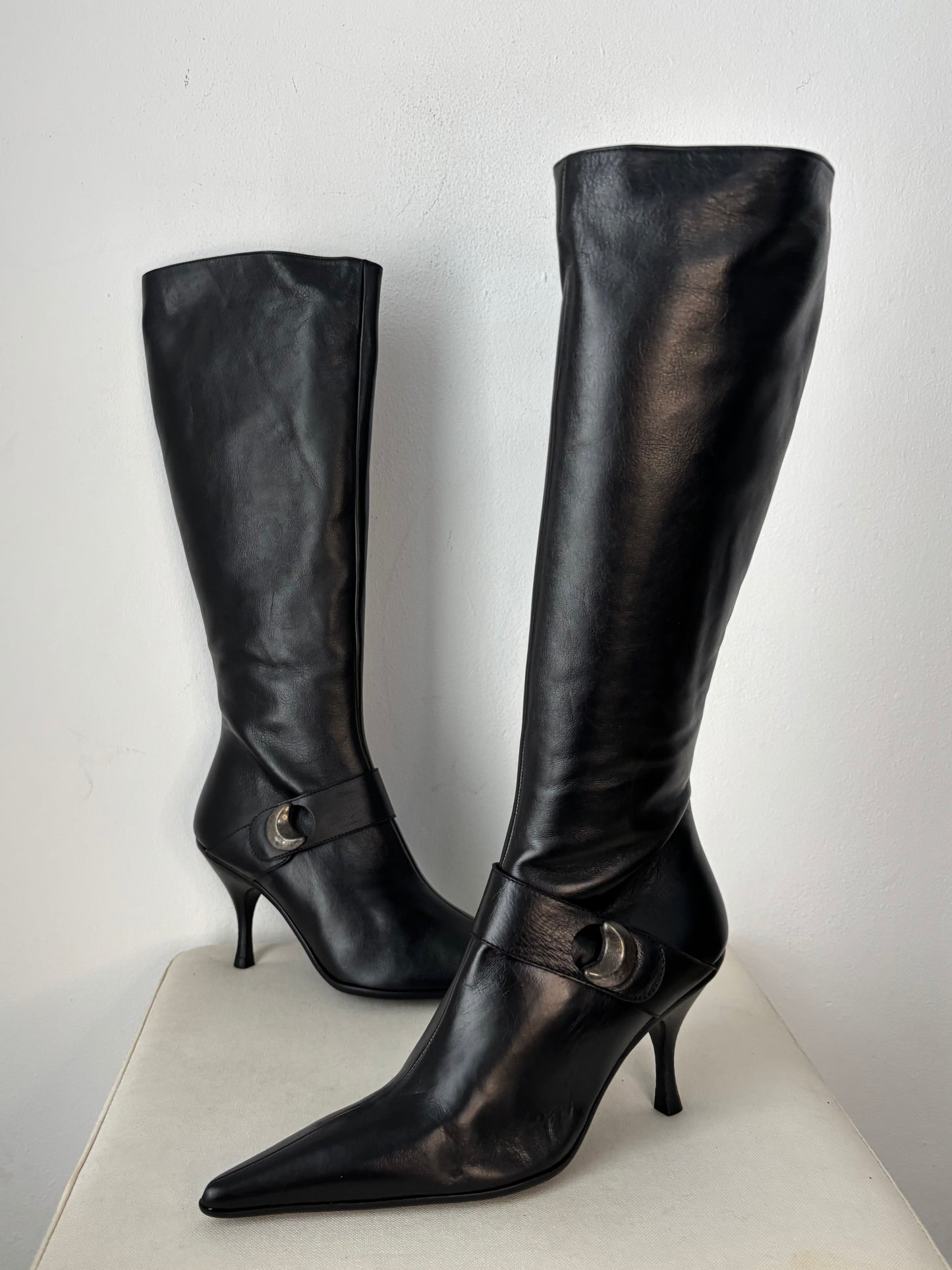 Black leather heeled boots with moon stud