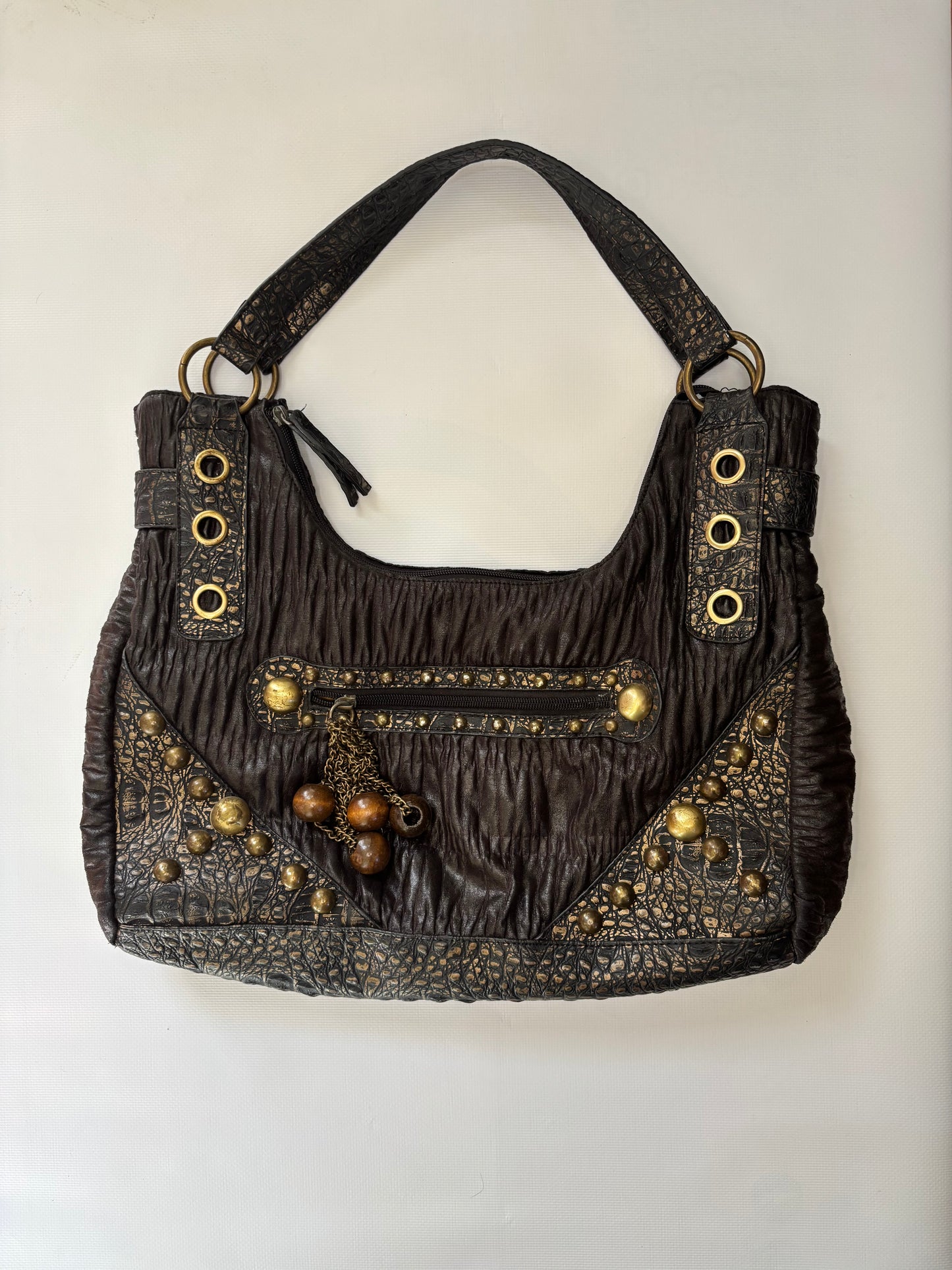 Brown leather bag with gold details