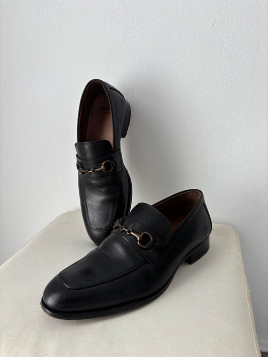 Black loafers with buckle