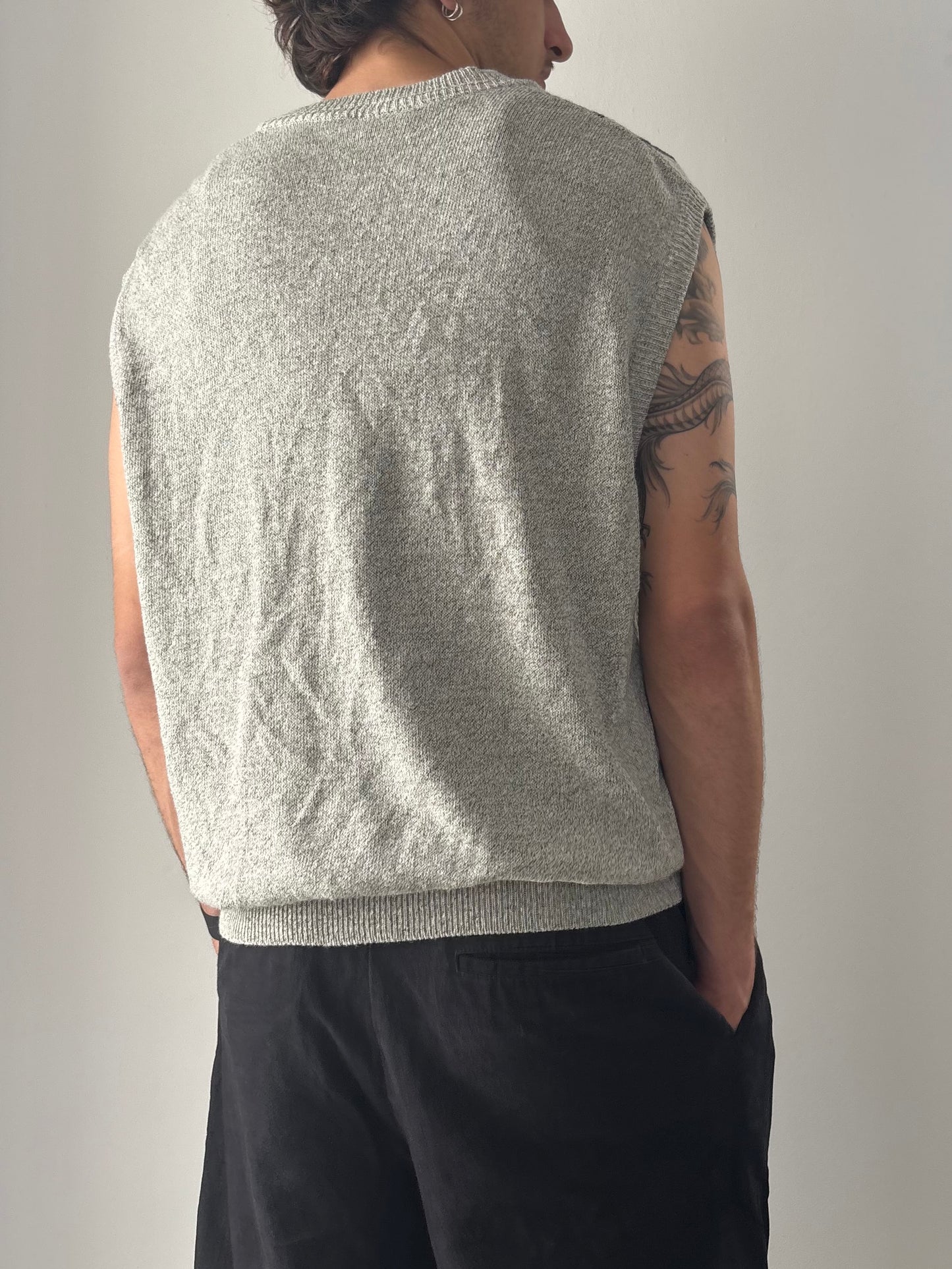 Grey sweater vest with patterns