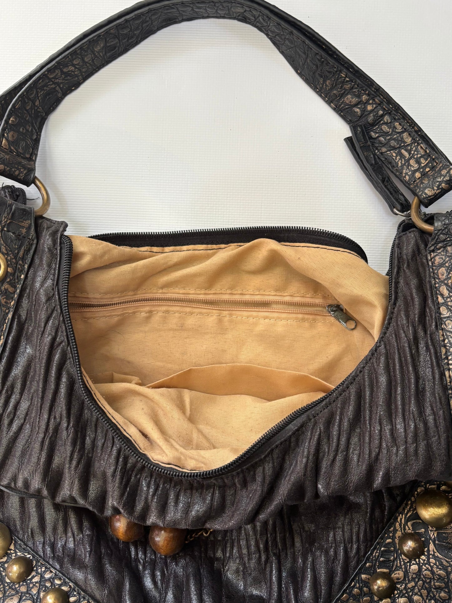 Brown leather bag with gold details