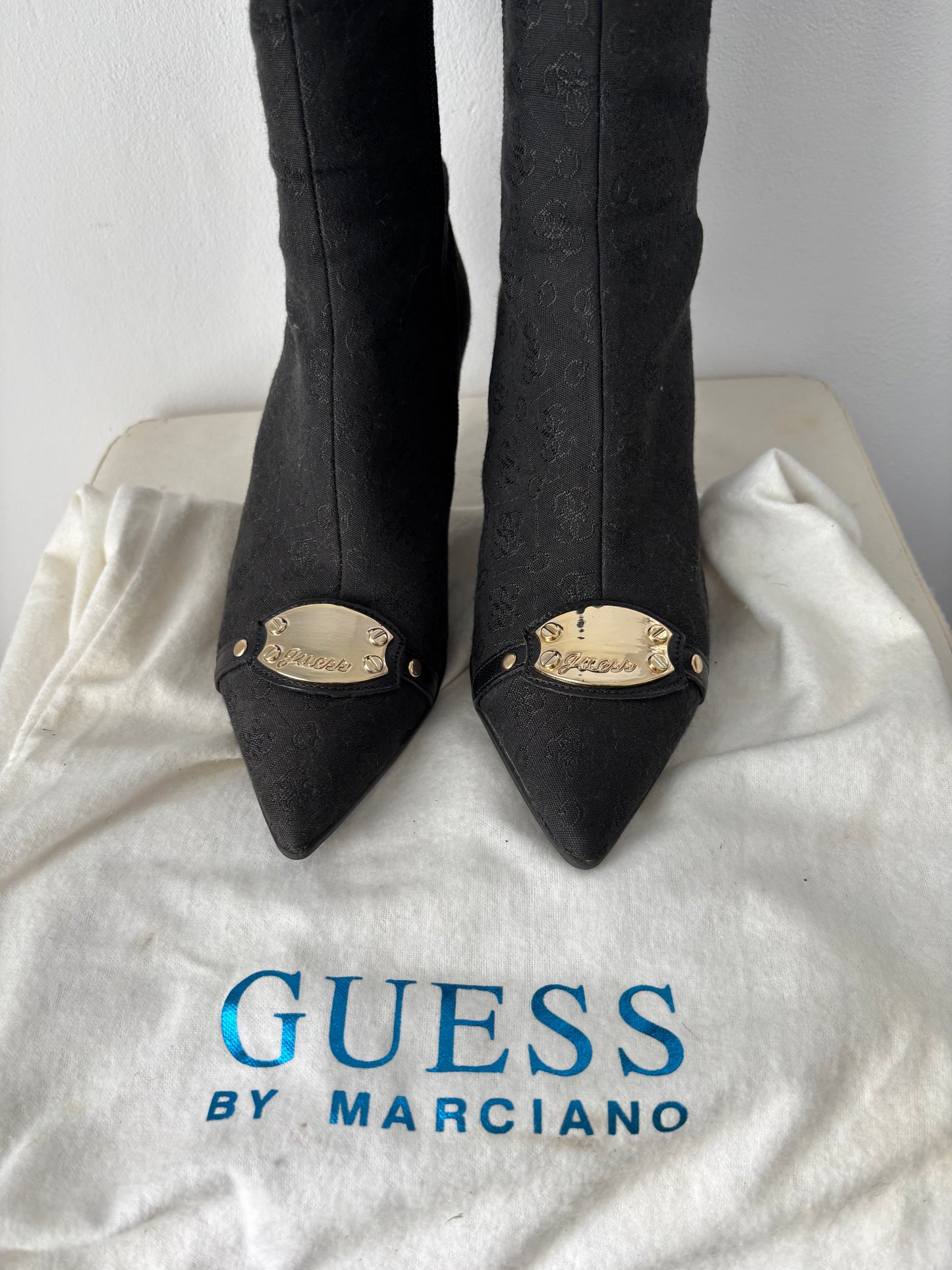 Guess heeled boots with gold buckle