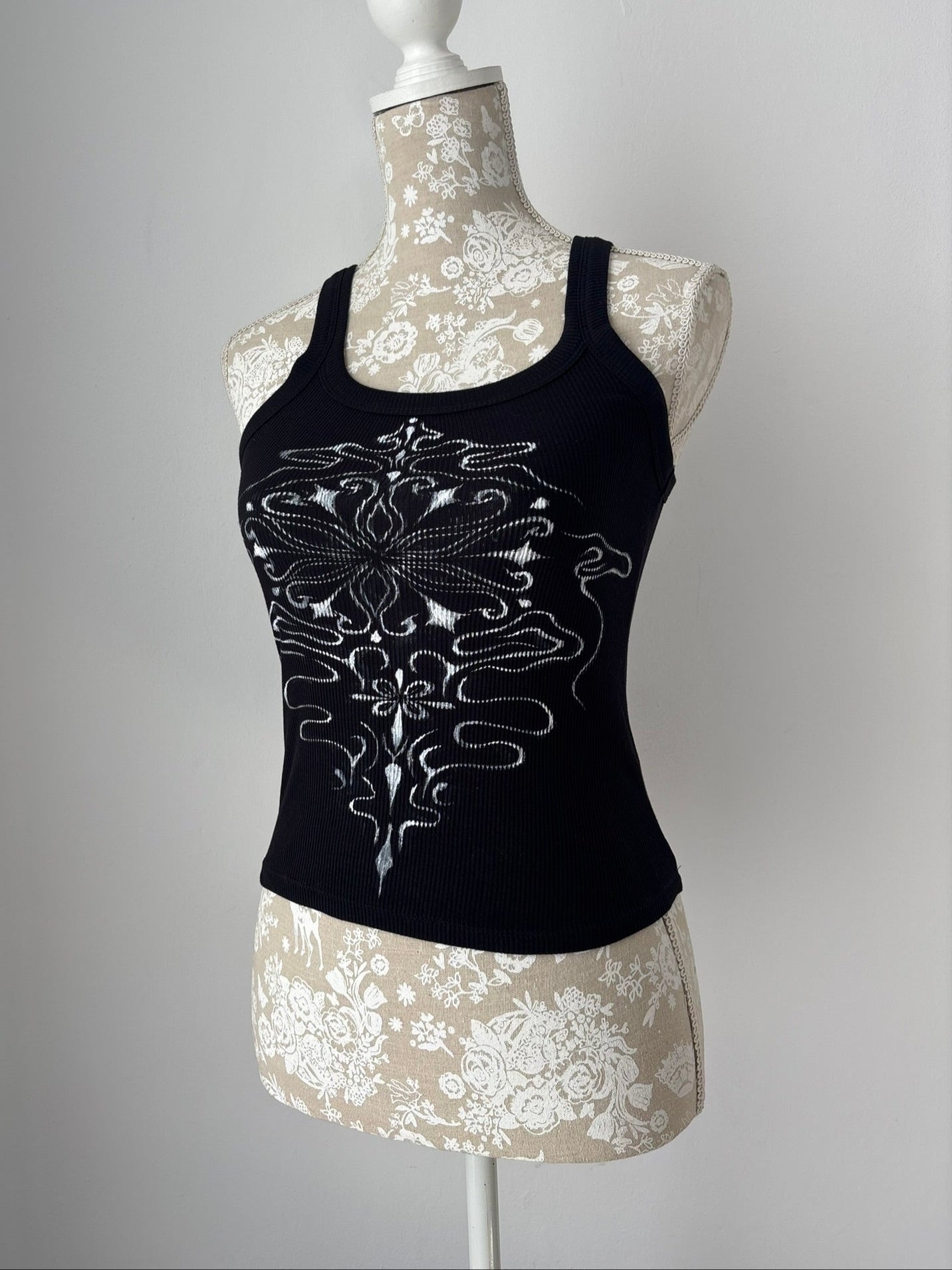 Reworked black tank top with fabric paint